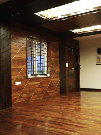 The geometric wall paneling adds a dynamic quality to the main office space.