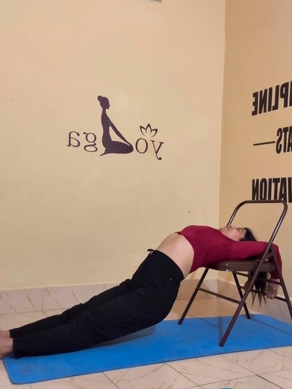 Using a chair for a supported fish pose. This is a wonderful restorative backbend that helps to open the chest and relieve stress.
