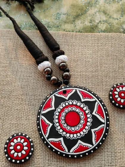 A classic and bold red, black, and white version of the hand-painted mandala necklace set.