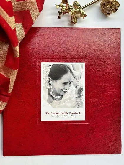 We had the honor of creating this beautiful, custom red silk-bound cookbook for the Mathur family. For corporate orders, we can weave your company's story and logo into the design, making it a truly personal and celebratory gift for your team or clients during the festive season or for special milestones.