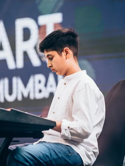 One of our keyboard students, deep in concentration during his performance at Art Mumbai. Our keyboard lessons cover everything from classical pieces to modern pop songs.