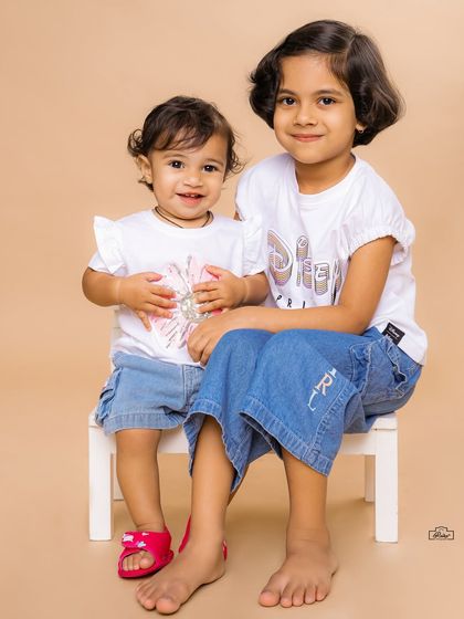 A sweet and simple portrait of two sisters posing together in our studio. We aim to capture both the playful and the calm moments that make up childhood.