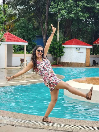 A playful kick by the poolside. It's all about bringing fun and carefree energy to the party.