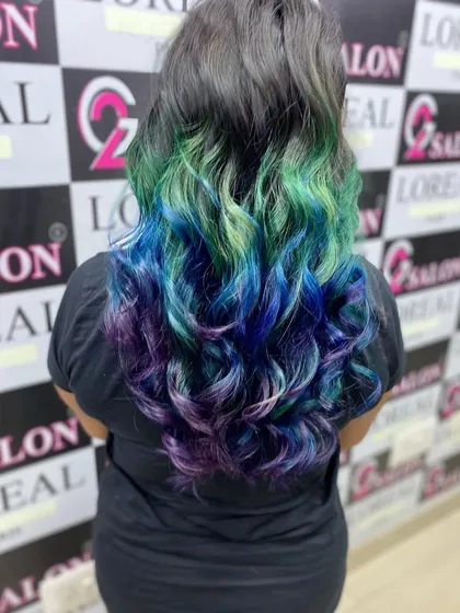 Don't be afraid to show your true colors. I specialize in vibrant, creative fashion hair coloring, blending shades like mermaid blue, green, and purple for a look that is uniquely you. Let's create something bold together.