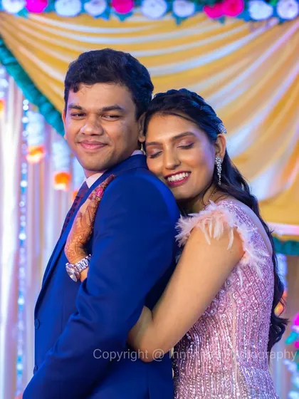 A warm, candid embrace between the couple during their engagement party. I look for these quiet, affectionate moments amidst the celebration.