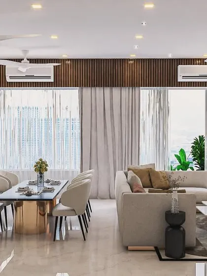 Another view of this 2000 sq. ft. apartment highlights the flow and light. The combination of a neutral sofa, a dining table with a metallic base, and warm wood accents creates a contemporary look that is both simple and full of texture.