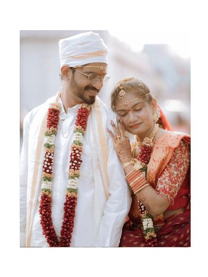 A tender moment between the couple, the bride resting her head on the groom's shoulder.