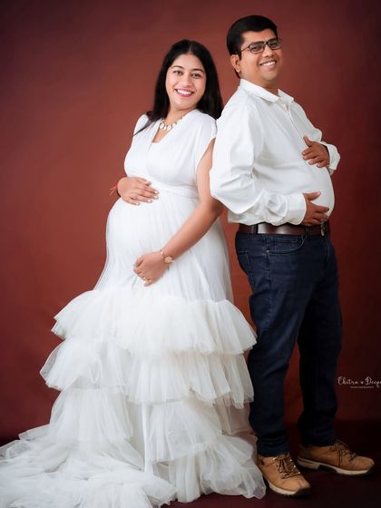 A fun "bump-off" pose! We love when couples bring their sense of humor to the shoot, creating playful and memorable photos.