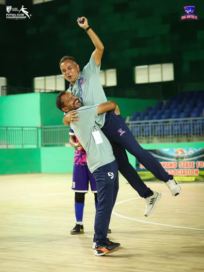 A moment of celebration between our head coach and assistant coach after the semi-final win.