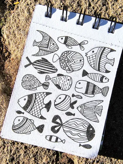 Sometimes, all you need is a pen and a small sketchbook to create something beautiful. This page of patterned fish doodles was a joy to make and a great way to practice line work.