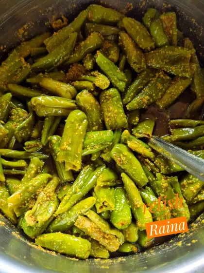 Here is a batch of stuffed green chillies being prepared. Once stuffed, they are mixed together to ensure the masala is evenly distributed before being packed into jars to mature.