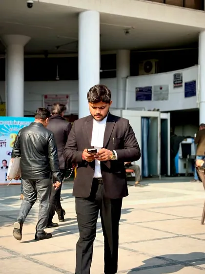 Focused on my phone in the court complex. The pride I have is the pride I've earned.