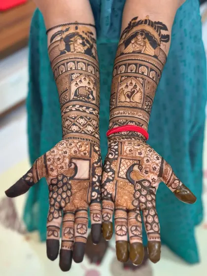 A unique design with a checkerboard pattern on the palms, surrounded by peacock and elephant motifs.
