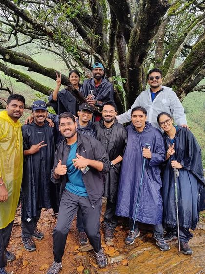 Taking a break under a magnificent old tree. Our treks are filled with these small, peaceful moments of connection, where you can rest, chat, and appreciate the nature and the company around you.