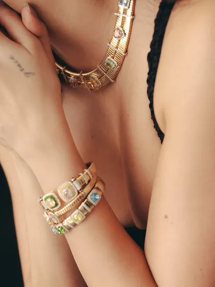 The star of our Antara X Jet Gems collection, the Sorbet Royale Set, is designed to steal the spotlight. This close-up shows the gem-studded Rainbow Collar and Bracelets, a playful yet classic design made to be collected and worn forever.