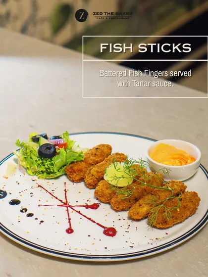 To start your meal, I recommend my golden-battered Fish Sticks. They are perfectly crispy on the outside and tender inside, served with a classic, creamy tartar sauce for dipping.