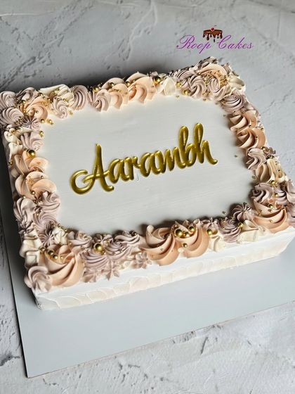 A sweet start to something beautiful. This elegant sheet cake with pastel rosettes is perfect for celebrating a new beginning.