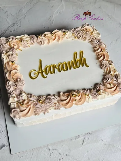 A sweet start to something beautiful. This elegant sheet cake with pastel rosettes is perfect for celebrating a new beginning.