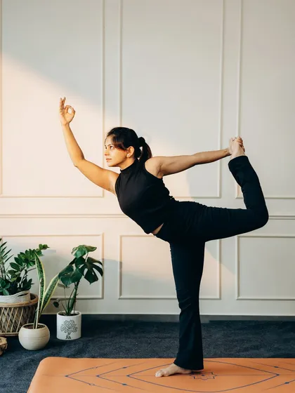 Natarajasana (Dancer's Pose) is a graceful balance that combines a standing posture with a backbend. It builds strength in the standing leg while opening the chest and shoulders, embodying both power and elegance.