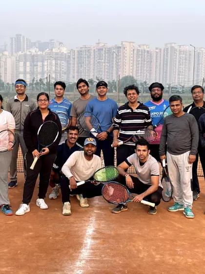 A group of competitors from our adult tennis league, ready for action on the clay court. The camaraderie is just as important as the competition.
