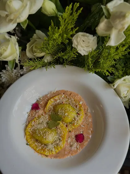 Our Spinach & Ricotta Ravioli, served in a delicate Pink a la Vodka sauce and plated with care. A comforting yet sophisticated choice.