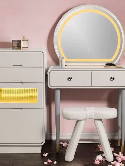 The Mystic Meridian vanity set is designed for ultimate organization. It includes a separate chest of drawers with an illuminated compartment, a sleek tabletop, and a round LED mirror, all paired with a cozy sherpa stool.