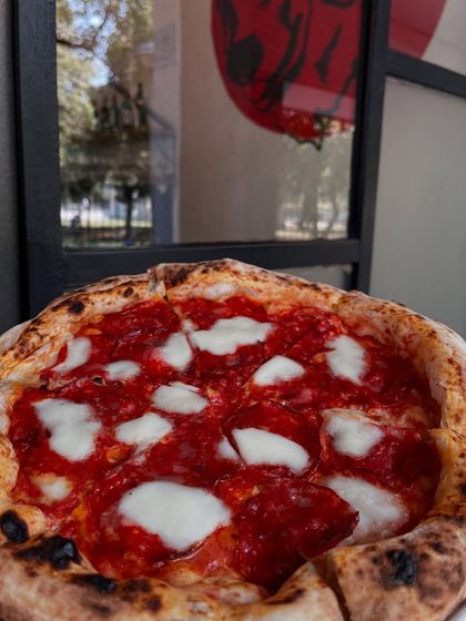 Our pepperoni pizza enjoying some sun. It's a perfect pie for any time of day.