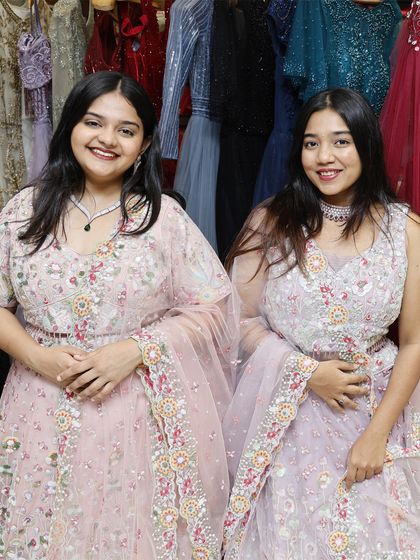 Double the style, double the glam. This photo shows two coordinated pastel lehengas, perfect for sisters or best friends attending a wedding.