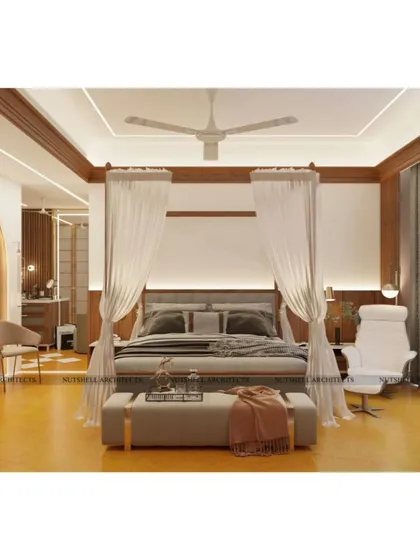 We designed this master bedroom as a serene retreat from the world. The four-poster bed with soft, flowing drapes creates a sense of sanctuary, while the warm Jodhpur stone flooring and rich walnut wood accents provide a feeling of grounded, timeless elegance.
