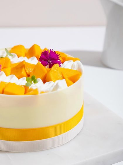 Can't keep calm because mango season is upon us! Our white chocolate mango cake is a celebration of this glorious fruit.