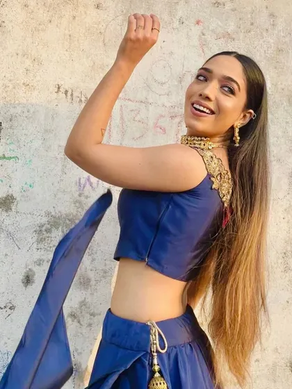 Elegance is a beauty that never fades. A candid, happy shot in a beautiful blue traditional outfit.