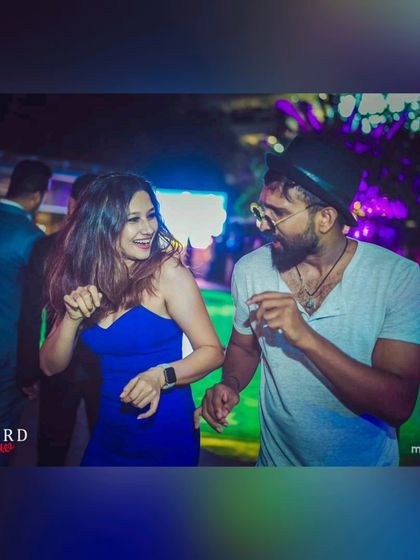 A happy couple dancing at my poolside gig at Seven Rivers. My music is all about creating moments of joy and connection.