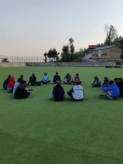 A throwback to a high-altitude training camp in Shillaroo. A team meeting on the grass, connecting with nature and each other.