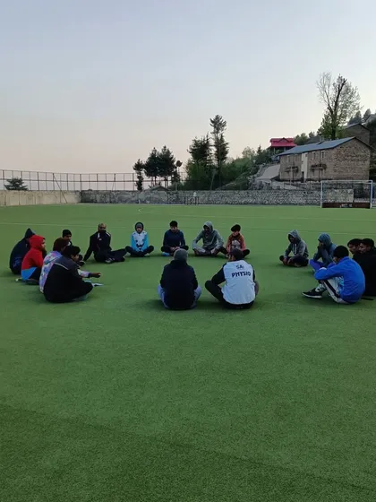 A throwback to a high-altitude training camp in Shillaroo. A team meeting on the grass, connecting with nature and each other.