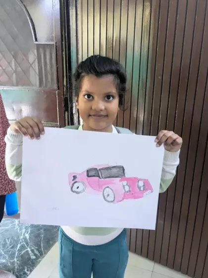 A cute pink vintage car painted by one of our younger students. This shows how we adapt themes like vehicle drawing for different age groups.
