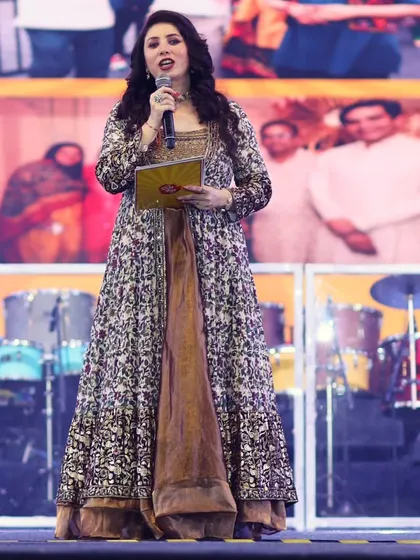 A full-length shot of me addressing the audience during the Chief Minister's visit.