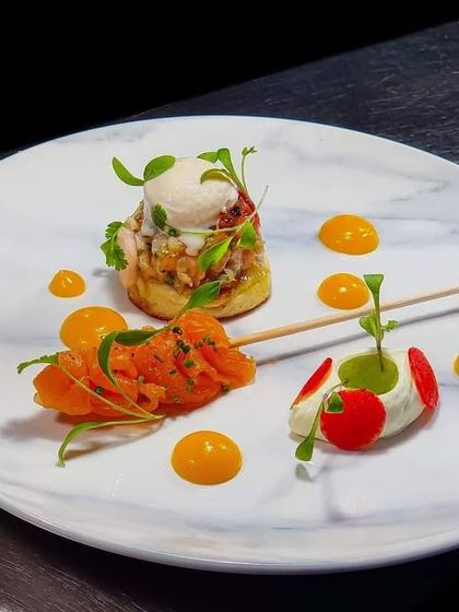 An example of our exquisite canapés, perfect for upscale events. This bite-sized creation features delicate layers of smoked salmon, cream cheese, and fresh herbs, meticulously assembled for a burst of flavour.