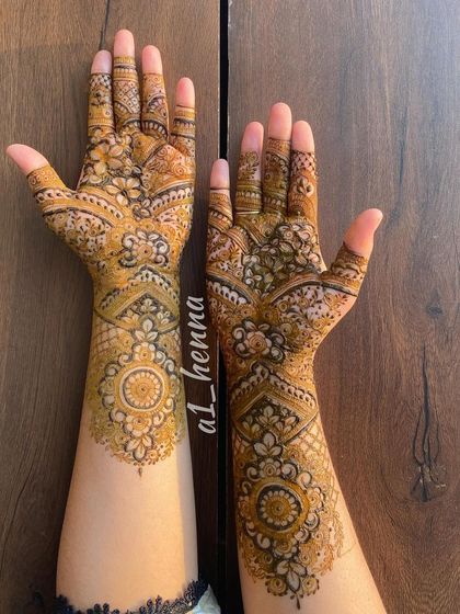 A beautiful semi-bridal design with mandalas and detailed finger work.