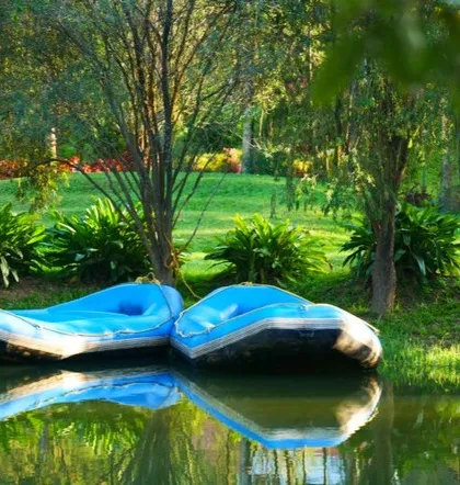 Inflatable rafts ready for a gentle float on the lake at Riverside Nature Resort in Coorg. It's a peaceful way to enjoy the water and the surrounding greenery.