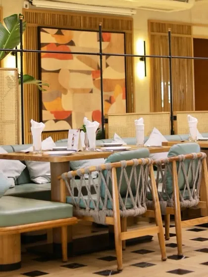 For Swagath restaurant, I designed nature-inspired and abstract artworks to enhance the ambiance. This floral mural uses soft tones to create a serene, garden-like feel in the dining space.