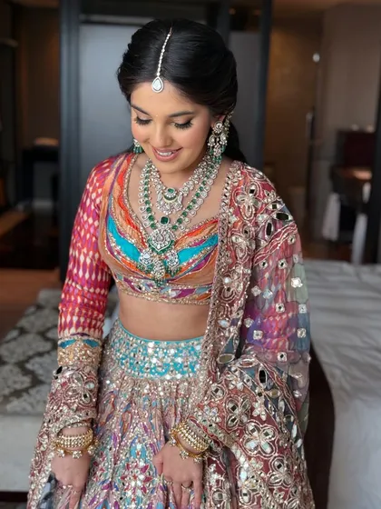 A happy and radiant portrait of the bride, ready for a night of dancing.