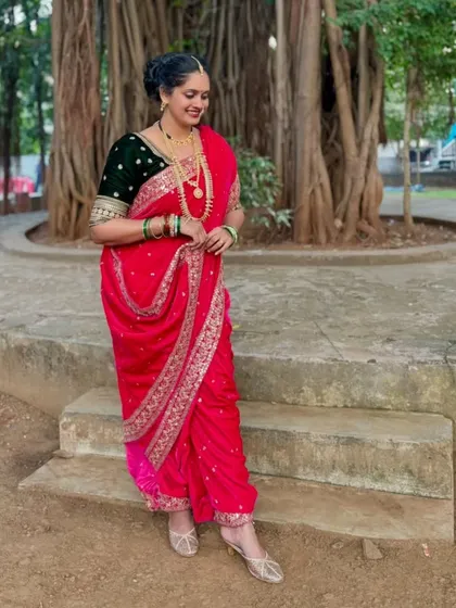 Embrace Maharashtrian heritage with this stunning pink velvet Nauvari saree. The traditional drape, combined with rich fabric and authentic jewelry, is a powerful statement of grace and cultural pride.