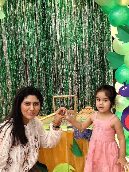 A mother and daughter share a sweet moment during our Janmashtami festivities. We love creating events where families can make lasting memories.