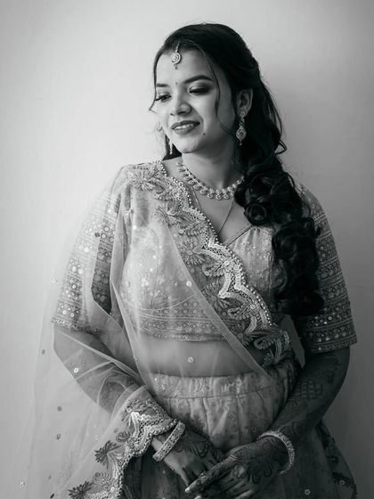A timeless black and white version of the bridal portrait, emphasizing her expression and the texture of her attire.