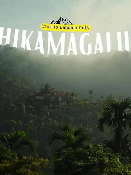 An introductory image for a Chikmagalur trek, showing a misty home nestled in the hills.