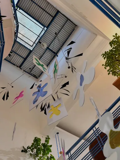 The view from below. We used the studio's vertical space to hang custom-made mobiles, adding a playful and artistic touch to the decor.