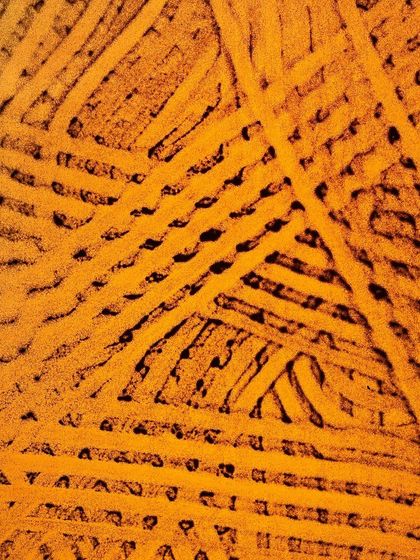 A duplicate of the triangular abstract from the 'Sand Sangam' series. The vibrant yellow color makes the intricate black linework stand out.