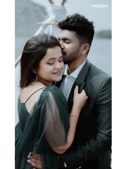 A tender and romantic pre-wedding portrait. The groom's gentle kiss on the forehead is a timeless expression of love.