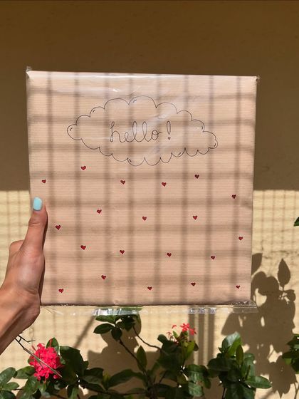 A finished package, all wrapped up and ready to go. The simple brown paper with hand-drawn hearts and a "hello" cloud is my way of sending a warm hug with every order.