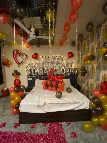 Another perspective of the complete anniversary room decoration. I use a mix of colors and elements to fill the space and ensure the surprise feels grand and thoughtful.